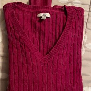 Magenta colored V-neck cable knit sweater